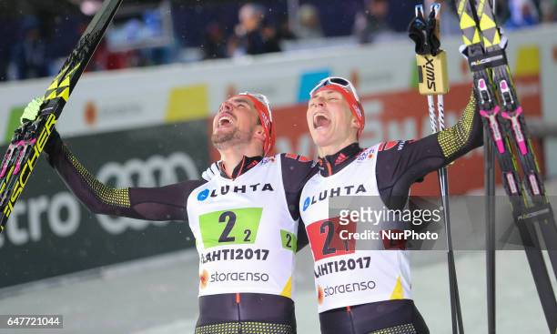 Johannes Rydzek and Eric Frenzel of Germany celebrate winning the gold medal in the Men's Nordic Combined HS130 Ski Jumping / 2 x 7.5km Team Sprint...