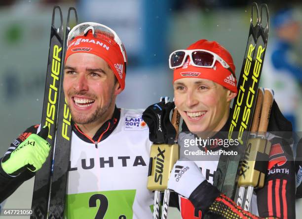 Johannes Rydzek and Eric Frenzel of Germany celebrate winning the gold medal in the Men's Nordic Combined HS130 Ski Jumping / 2 x 7.5km Team Sprint...