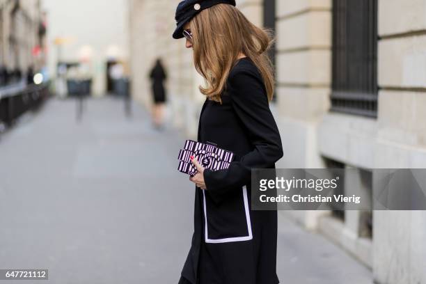 Alexandra Lapp wearing Couture Latex socks - Atsuko Kudo, coat - Steffen Schraut Pumps - Saint Laurent, Cap - Chanel, Bag - Chanel Lego Brique bag in...