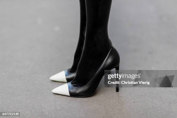 Alexandra Lapp wearing Couture Latex socks - Atsuko Kudo, coat - Steffen Schraut Pumps - Saint Laurent, Cap - Chanel, Bag - Chanel Lego Brique bag in...