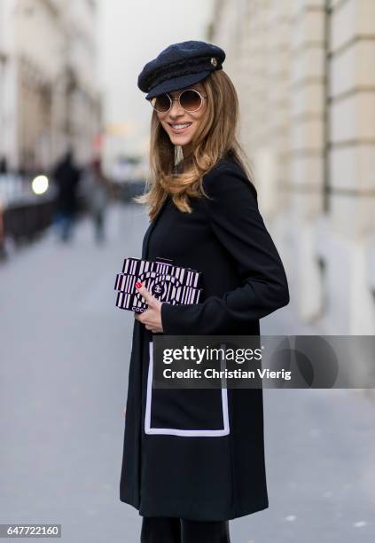 Alexandra Lapp wearing Couture Latex socks - Atsuko Kudo, coat - Steffen Schraut Pumps - Saint Laurent, Cap - Chanel, Bag - Chanel Lego Brique bag in...