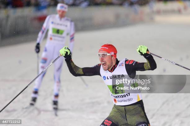 Johannes Rydzek of Germany celebrates winning the gold medal in the Men's Nordic Combined HS130 Ski Jumping / 2 x 7.5km Team Sprint Cross Country...