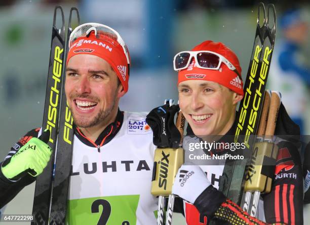 Johannes Rydzek and Eric Frenzel of Germany celebrate winning the gold medal in the Men's Nordic Combined HS130 Ski Jumping / 2 x 7.5km Team Sprint...