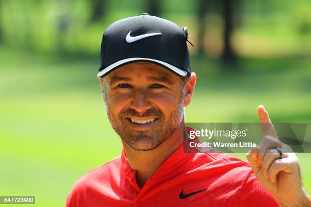 Trevor Immelman of South Africa poses for a photo later on in the round after scoring a hole-in-one on the 5th hole during day three of the Tshwane...