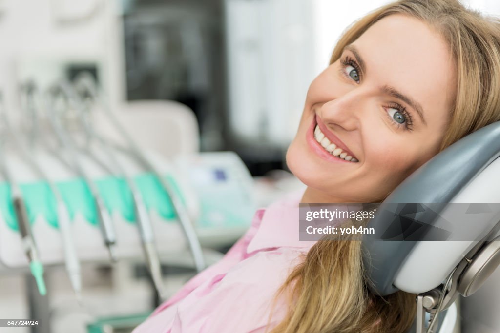 Attractive young woman visiting dentist
