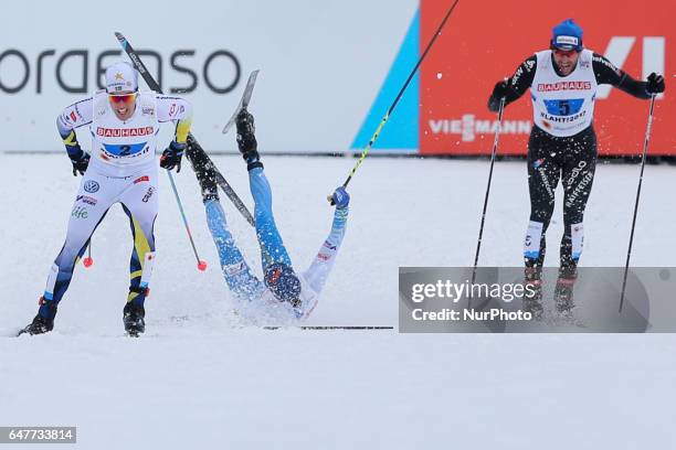 Calle Halfvarsson , Matti Heikkinen , Curdin Perl , compete during the men's cross-country 4x10 km relay event of the 2017 FIS Nordic World Ski...