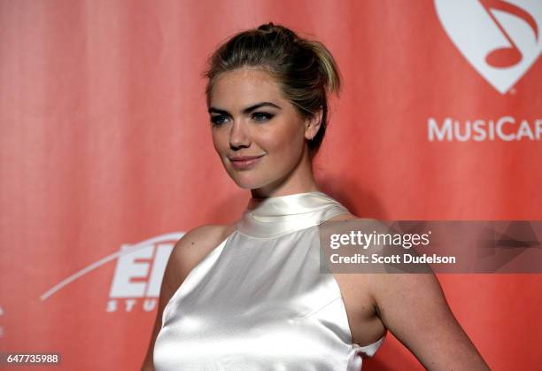 Model Kate Upton attends the 2017 MusiCares Person of the Year pre-show arrival red carpet on February 10, 2017 in Los Angeles, California.