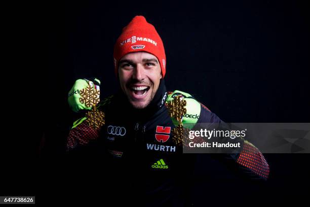 In this handout supplied by NordicFocus, Johannes Rydzek of Germany poses with the four gold medals he won during the FIS Nordic World Ski...