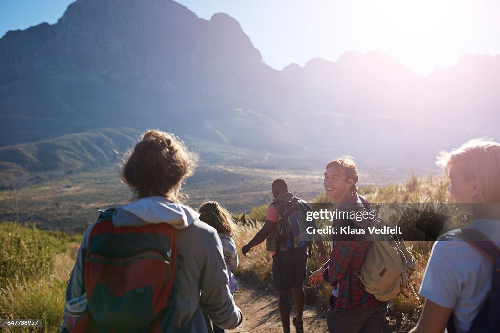 Friends trekking in the mountains and laughing