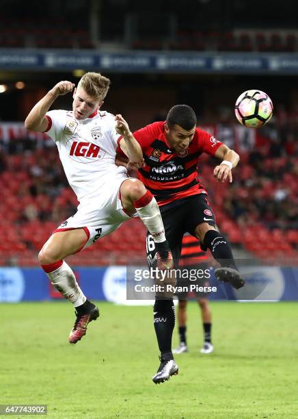 Riley McGree of Adelaide United competes for the ball against Jaushua Sotirio of the Wanderers during the round 22 A-League match between the Western...