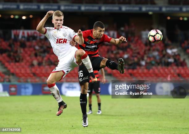 Riley McGree of Adelaide United competes for the ball against Jaushua Sotirio of the Wanderers during the round 22 A-League match between the Western...