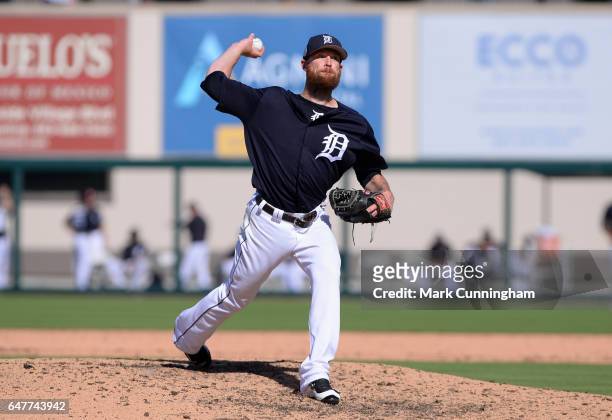 Logan Kensing of the Detroit Tigers pitches during the Spring Training game against the Baltimore Orioles at Publix Field at Joker Marchant Stadium...