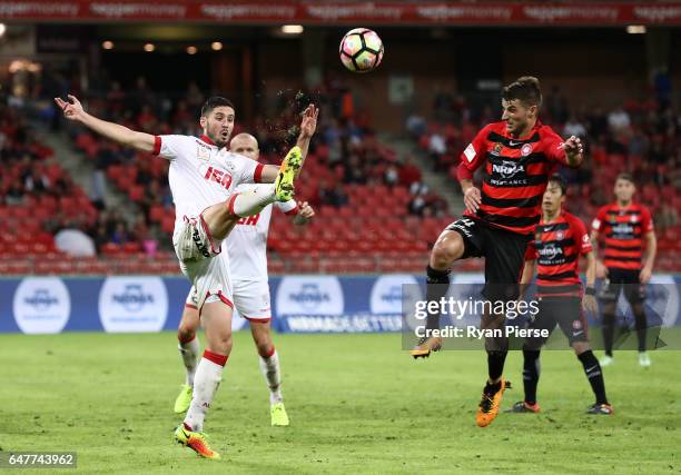 Dylan McGowan of Adelaide United clears the ball from Terry Antonis of the Wanderers during the round 22 A-League match between the Western Sydney...