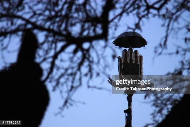 panja as a sign of shia islam - muharram fotografías e imágenes de stock