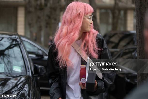 Fernanda Ly outside the Dior show on March 3, 2017 in Paris, France.