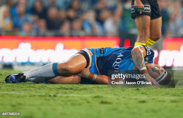 Chris Mcqueen of the Titans suffers an injury during the round one NRL match between the Gold Coast Titans and the Sydney Roosters at Cbus Super...