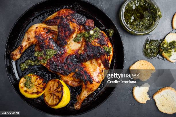 barbequed chicken with chimichurri sauce - grilled chicken stock-fotos und bilder