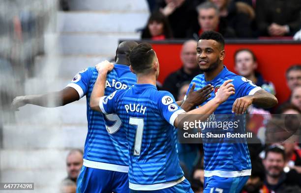 Joshua King of AFC Bournemouth celebrates scoring his sides first goal with Benik Afobe of AFC Bournemouth and Marc Pugh of AFC Bournemouth during...