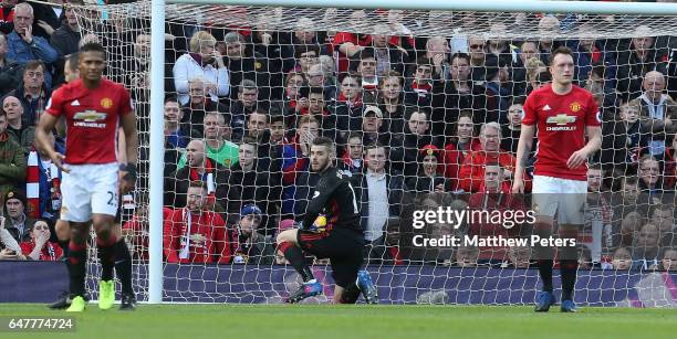 David de Gea of Manchester United reacts to conceding a penalty to Joshua King of AFC Bournemouth during the Premier League match between Manchester...