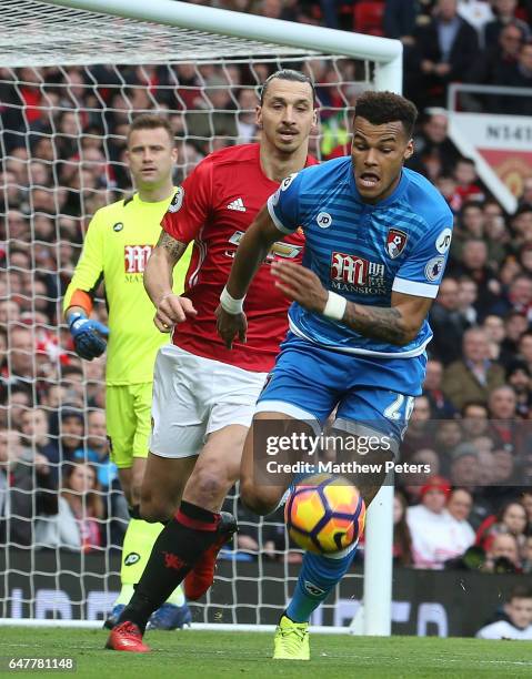 Zlatan Ibrahimovic of Manchester United in action with Tyrone Mings of AFC Bournemouth during the Premier League match between Manchester United and...