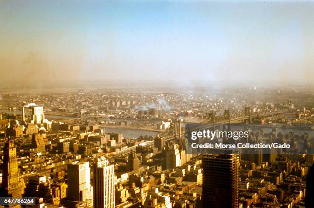 Panoramic view facing northeast of the Upper East Side of Manhattan, the East River, and Astoria, Queens, in New York City, New York, 1956. In the...