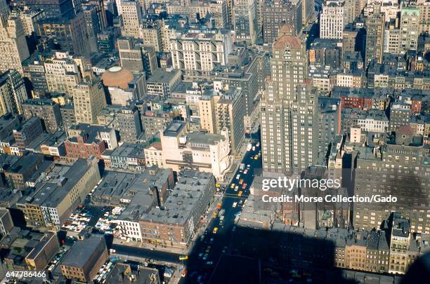 Detail view facing northwest of Sixth Avenue between 53rd and 57th Streets in midtown Manhattan, New York City, 1957. At center sits the original...