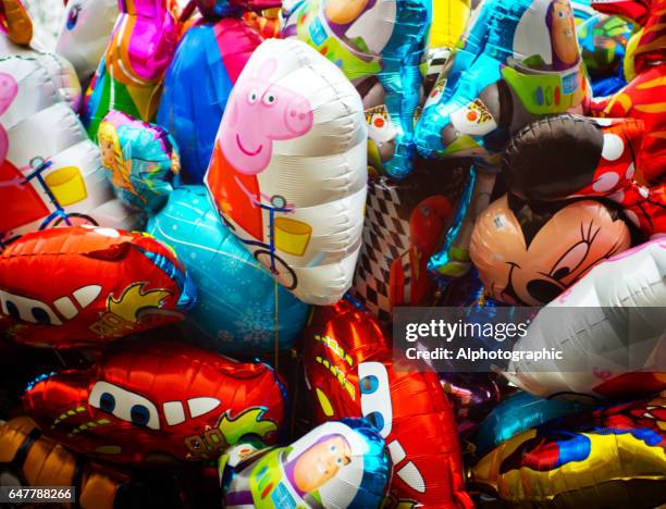 colourful balloons - peppa pig stock pictures, royalty-free photos & images