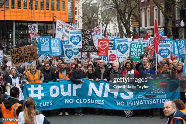 Shadow Chancellor John McDonnell and actress Julie Hesmondhalgh join protesters as they carry banners and placards through central London during a...