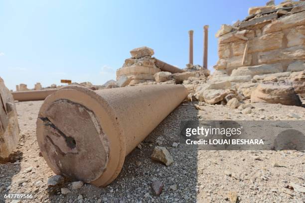 Picture taken on March 4, 2017 shows a fallen column at the site of the ancient city of Palmyra in central Syria. Syrian troops backed by Russian...