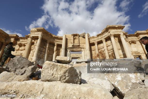 Picture taken on March 4, 2017 shows the damaged Roman amphitheatre in the ancient city of Palmyra in central Syria. Syrian troops backed by Russian...