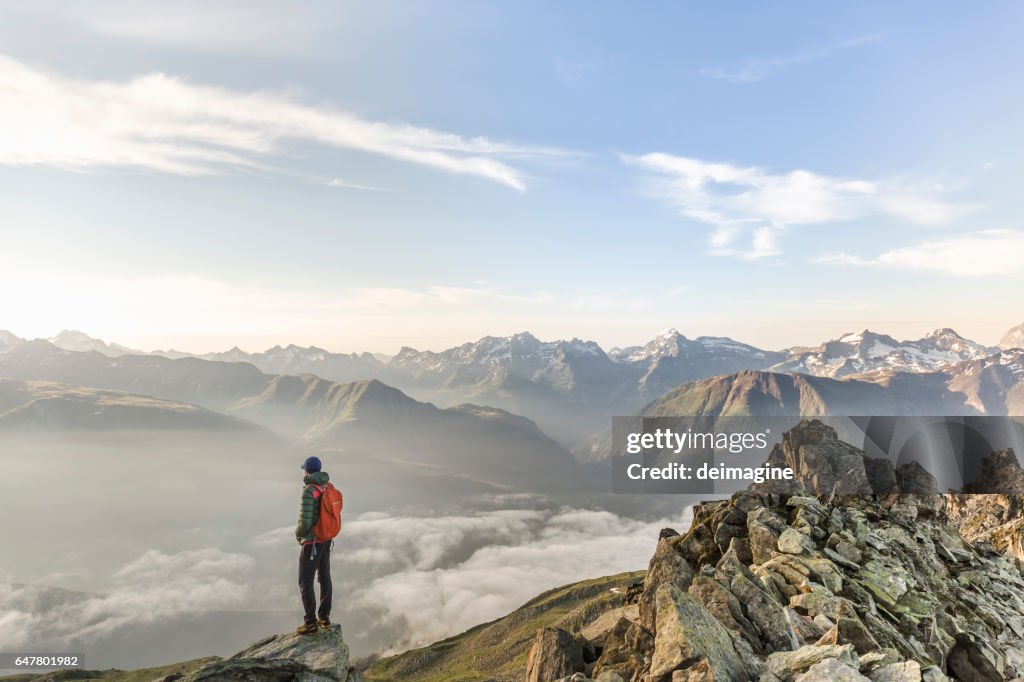 Hiker looking at mountain range