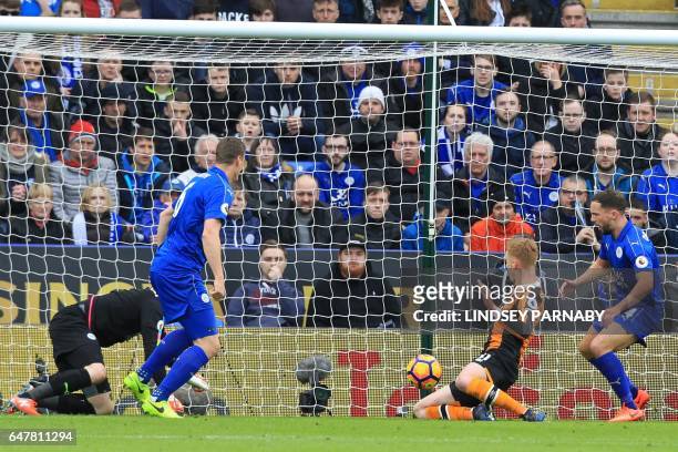 Hull City's English midfielder Sam Clucas scores the opening goal of the English Premier League football match between Leicester City and Hull City...