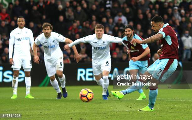 Andre Gray of Burnley scores his sides first goal from the penalty spot during the Premier League match between Swansea City and Burnley at Liberty...