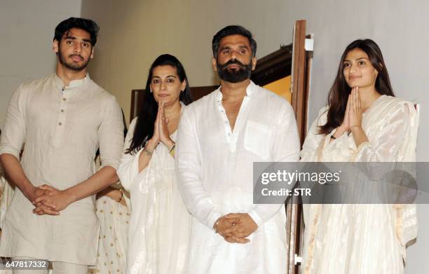 Indian Bollywood actor Suniel Shetty poses with his wife Mana Shetty son Aahan Shetty and daughter Athiya Shetty as they attend a prayer meeting for...