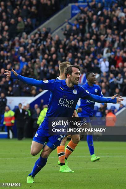 Leicester City's Austrian defender Christian Fuchs celebrates after scoring their first goal during the English Premier League football match between...