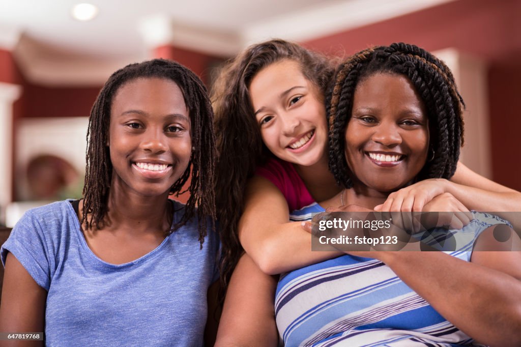 Multi-ethnic, foster care family at home.