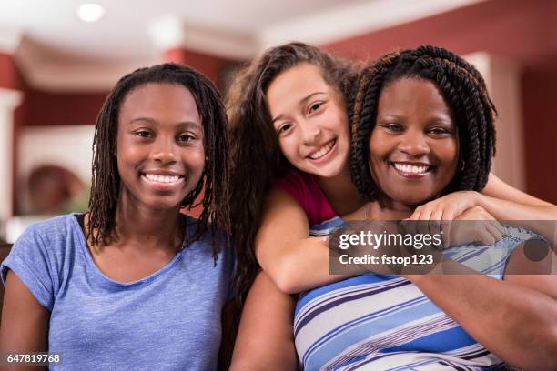 multi-ethnic, foster care family at home. - foster care stock pictures, royalty-free photos & images