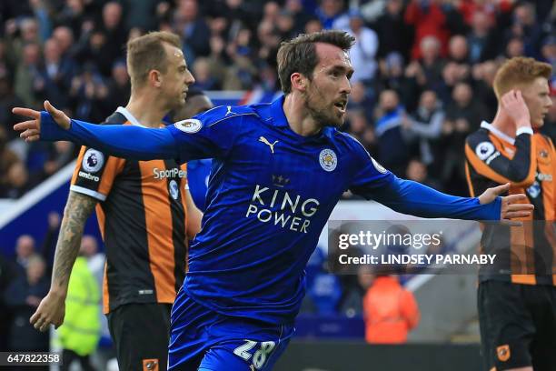 Leicester City's Austrian defender Christian Fuchs celebrates after scoring their first goal during the English Premier League football match between...