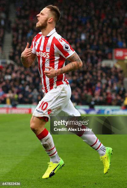 Marko Arnautovic of Stoke City celebrates scoring his sides first goal during the Premier League match between Stoke City and Middlesbrough at Bet365...