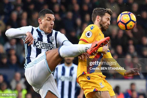 West Bromwich Albion's English midfielder Jake Livermore vies with Crystal Palace's French midfielder Yohan Cabaye during the English Premier League...