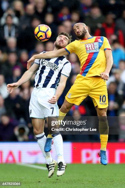 James Morrison of West Bromwich Albion and Andros Townsend of Crystal Palace battle to win a header during the Premier League match between West...