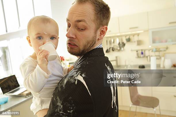 father and baby, yogurt spilt down suit - spilling bildbanksfoton och bilder