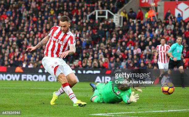 Marko Arnautovic of Stoke City scores his sides first goal past Victor Valdes of Middlesbrough during the Premier League match between Stoke City and...