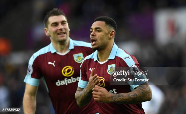 Andre Gray of Burnley celebrates scoring his sides first goal during the Premier League match between Swansea City and Burnley at Liberty Stadium on...