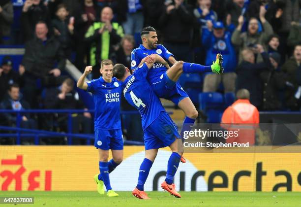 Riyad Mahrez of Leicester City celebrates scoring his sides second goal with Danny Drinkwater of Leicester City during the Premier League match...