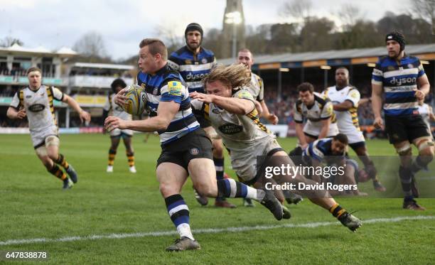 Chris Cook of Bath breaks clear of Tommy Taylor during the Aviva Premiership match between Bath and Wasps at the Recreation Ground on March 4, 2017...