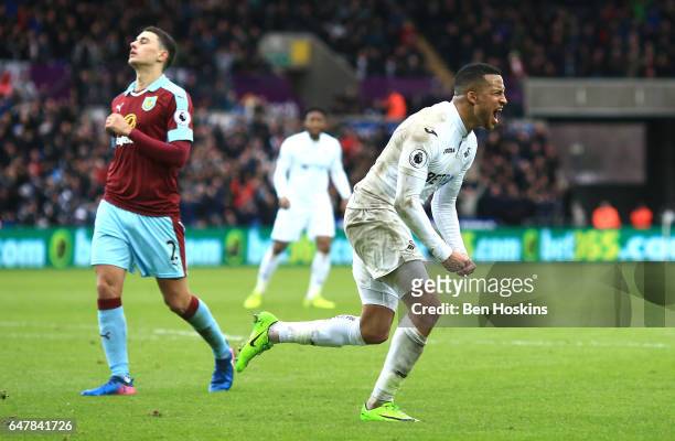 Martin Olsson of Swansea City celebrates scoring his sides second goal during the Premier League match between Swansea City and Burnley at Liberty...