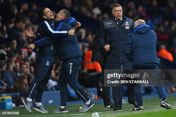 Crystal Palace's English manager Sam Allardyce and assistants celebrate their second goal during the English Premier League football match between...