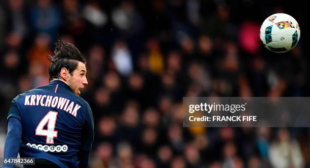 Paris Saint-Germain's polish defender Grzegorz Krychowiak heads the ball during the French L1 football match between Paris Saint-Germain and Nancy at...