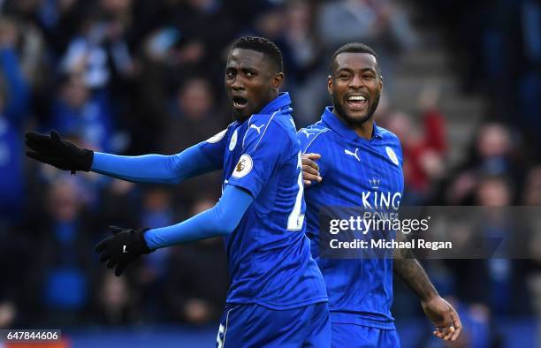 Wilfred Ndidi of Leicester City celebrates with Wes Morgan of Leicester City after Tom Huddlestone of Hull City scored a own goal for Leicester City...